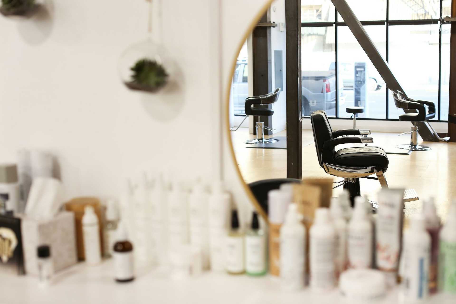 Hair Salon with salon chairs reflected in a mirror